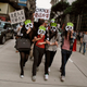 Protesters wearing panda masks take part in a protest march in Macau on the anniversary of the territory's handover to China December 20, 2010
